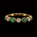 Gold Ring with Oval Shaped Emeralds and Round Diamonds