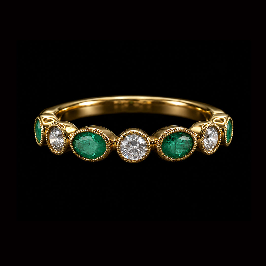 Gold Ring with Oval Shaped Emeralds and Round Diamonds
