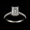 Emerald and Round Shaped Diamonds in Silver Ring